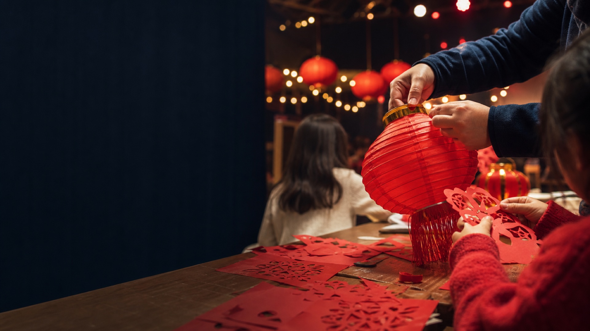 Families making lanterns at a Bowen cultural event